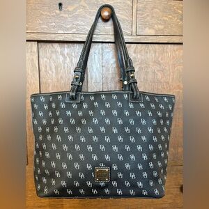 Dooney Bourke black/gray canvas, monogram tote bag leather trim with red lining